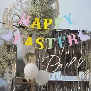 Close-up of glitter Happy Easter banner with colorful letters and purple rabbit shapes