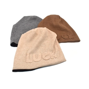 Thick knit beanies for women in grey, brown, and beige with LUCK embossed letters