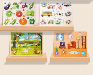 Close-up of four wooden peg puzzles with themes of animals, transport, and vegetables