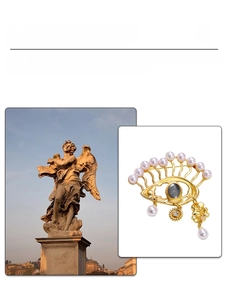 Detailed view of Evil Eye brooch with pearls and gold pendant in artistic layout