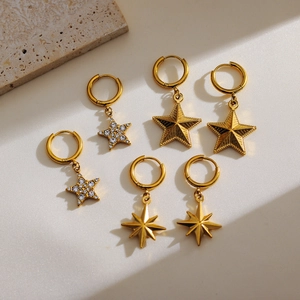 Three pairs of elegant gold star dangle earrings with rhinestones and starburst motifs