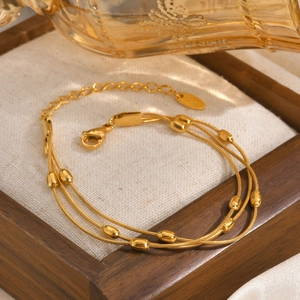 Three-layer stainless steel snake chain bracelet with oval beads in gold plating