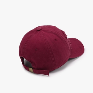 Vintage burgundy distressed baseball cap with ripped details and adjustable metal buckle