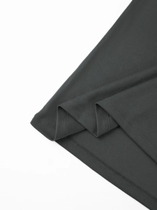Detail of dark grey breathable mesh fabric and double-needle stitching on polo shirt