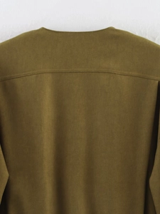 Detailed macro view of the army green jacket neck seam and twill fabric texture