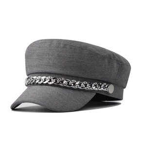 Dark grey vintage baker boy hat with silver rhinestone chain decoration on white background