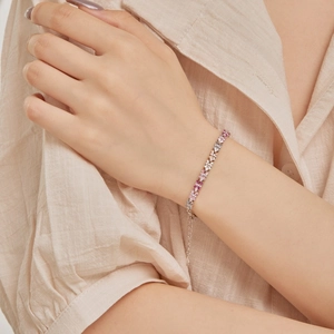 Elegant S925 sterling silver floral bracelet with colorful zircon stones on model's wrist
