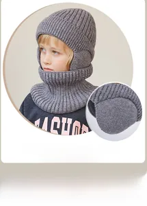 Detail of grey winter knitted hooded scarf with warm fleece lining for children