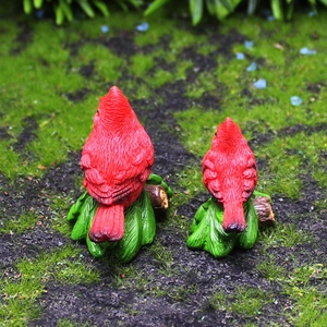 Red bird resin figurines set on green leaf bases for garden and desktop decoration
