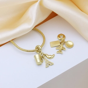 18k gold plated adjustable bracelet featuring Eiffel Tower, airplane and coffee charms
