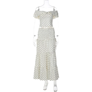 Detail of polka dot crop top and layered maxi skirt on mannequin set