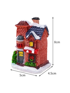 Detailed dimensions of a glowing resin Christmas house ornament with Gift shop text