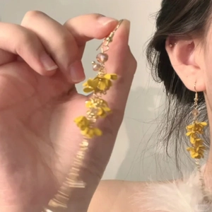 Sweet yellow floral tassel earrings with glass beads and a fresh blooming flower design