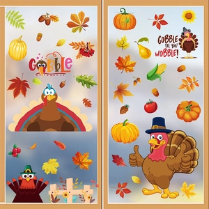 Detail of Thanksgiving window clings featuring cartoon turkeys, maple leaves and pumpkins