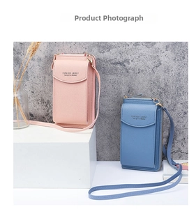 Detail of pink and blue matte PU leather phone crossbody bags with gold hardware zippers