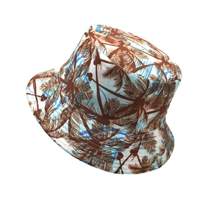 Reversible bucket hat with tropical palm tree print for summer outdoor sun protection