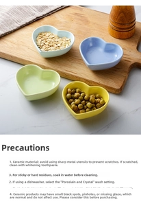 Macro detail of heart-shaped ceramic dipping bowls in four pastel colors on marble surface