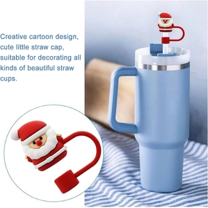 Creative Santa Claus silicone straw cover for 10mm cups, shown on a blue tumbler