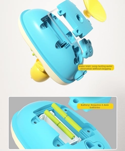 Detail of baby bath toy boat showing waterproof battery compartment and water inlet
