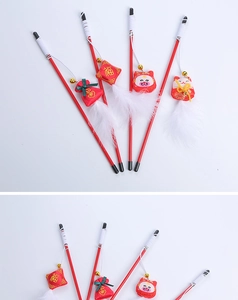 Detailed set of red festive cat teaser sticks featuring embroidery, bells, and feathers