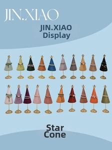 Colorful velvet cone jewelry displays with gold star tops for bracelets and bangles