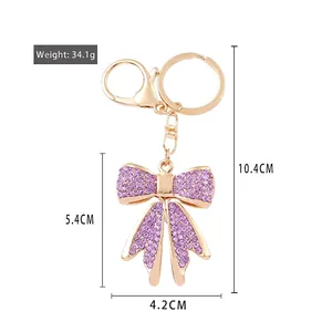 Portachiavi con fiocco in cristallo scintillante con strass viola per borse e auto