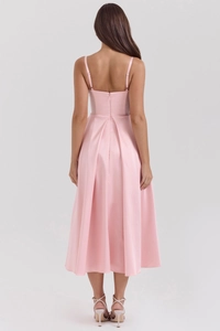 Detailed back view of a pink satin midi dress featuring thin adjustable straps and a zipper