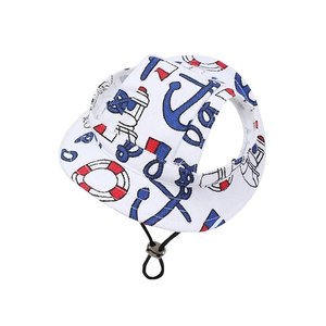Close-up of canvas pet sun hat with anchor patterns and adjustable black chin strap
