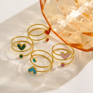 Spiral stainless steel 14K gold rings with colorful heart charms and matching gemstones