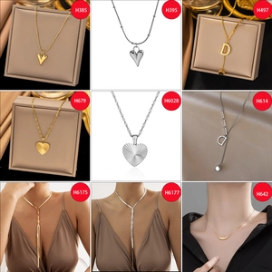 Collage of titanium steel necklaces featuring gold heart pendants and D-letter charms