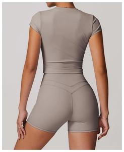 Detail of high-waist yoga shorts with V-shaped rear seam and moisture-wicking fabric