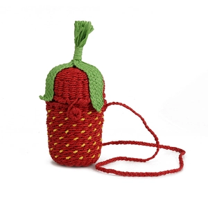 Cute woven strawberry bucket bag with red body and green leaves on white background