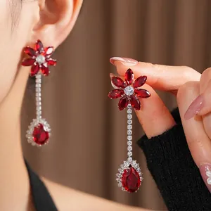 Vintage zircon flower earrings with ruby red pear-shaped pendant and gold plating