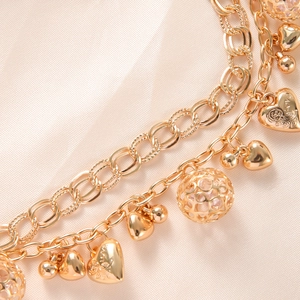 Bracciale multistrato placcato oro con ciondoli a sfera cava e pendente a cuore su seta