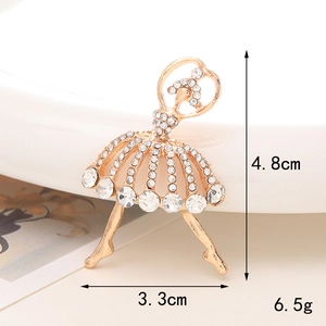 Detail shot of golden ballet dancer brooch with white rhinestones showing 4.8cm height