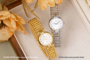 Detailed macro of gold and silver luxury quartz watches with beaded jewelry bands