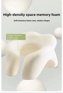 Detail of high-density memory foam material showing soft texture and ergonomic curvature