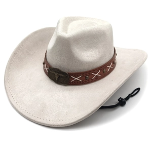 Detail of faux suede cowboy hat featuring a leather band and bull skull metal buckle
