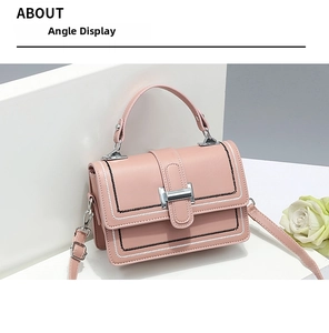Detailed view of pink PU leather handbag with silver magnetic buckle and contrast stitching
