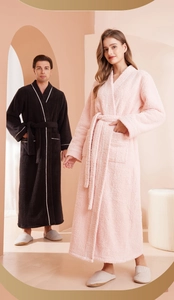 Detailed view of plush flannel robes with shawl collar and contrast piping details
