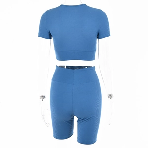 Rear view of blue ribbed knit two-piece set featuring cropped top and high-waist shorts