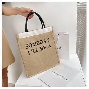 Detailed macro view of natural jute tote fabric with black text and round handles