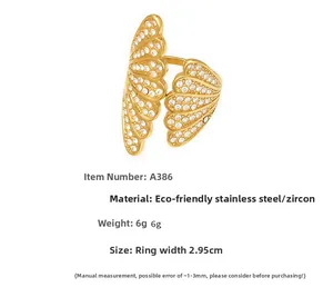 Detailed macro view of 18k gold plated stainless steel ring with 5A zircon wing design