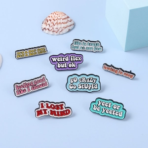 Set of 8 creative enamel pins with motivational quotes and colorful metal alloy finishes