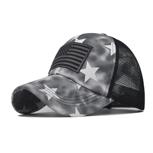 Detail of grey camo baseball cap with star prints and American flag patch detail
