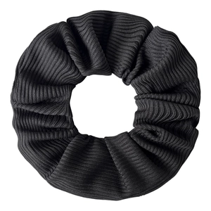 Close-up of black tie-dye velvet scrunchie showing ribbed texture and zipper detail