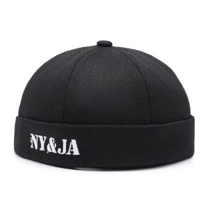 Classic black cotton docker hat with white NY&JA letter embroidery in retro street style
