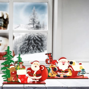 Christmas wooden tabletop decor set with Santa, reindeer and JOY sign on a snowy background