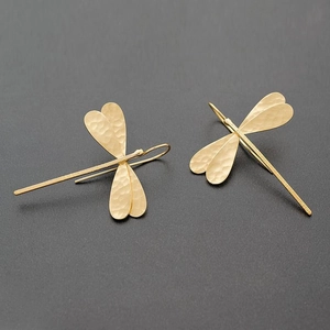 Fashionable golden hammered metal dragonfly drop earrings for women in a minimalist style