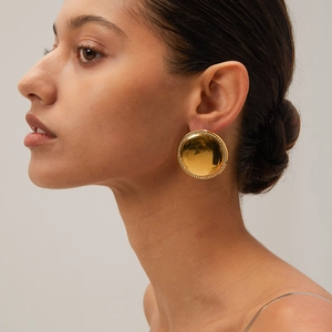 Polished 18K gold-plated large round stud earrings with sparkling crystals on model